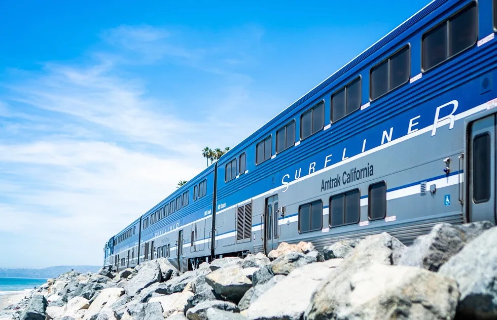 Amtrak Pacific Surfliner travels along beach in Southern California