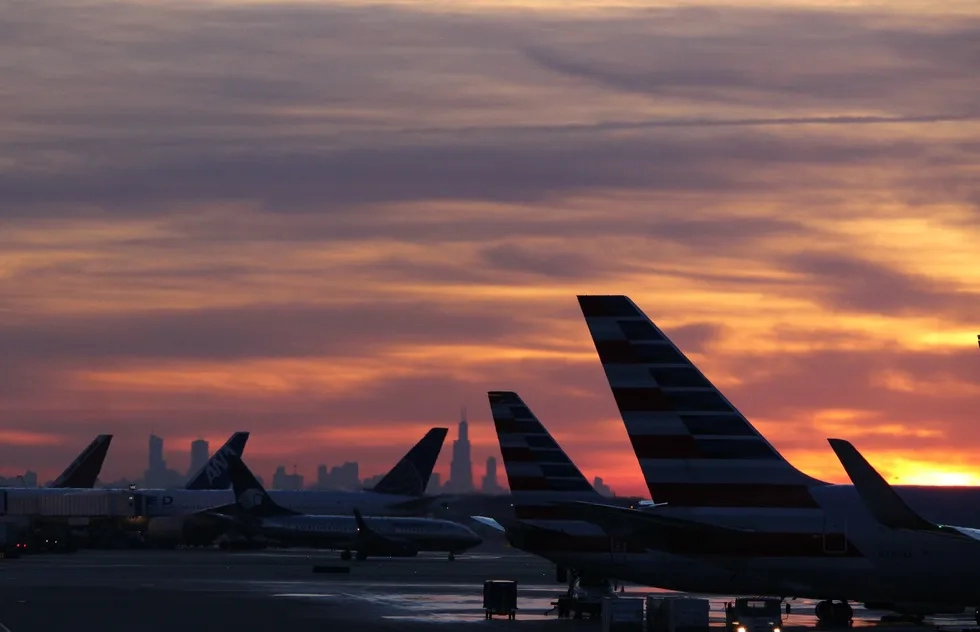 airplane tail fins silhouetted at sunrise, Midway Airport, Chicago