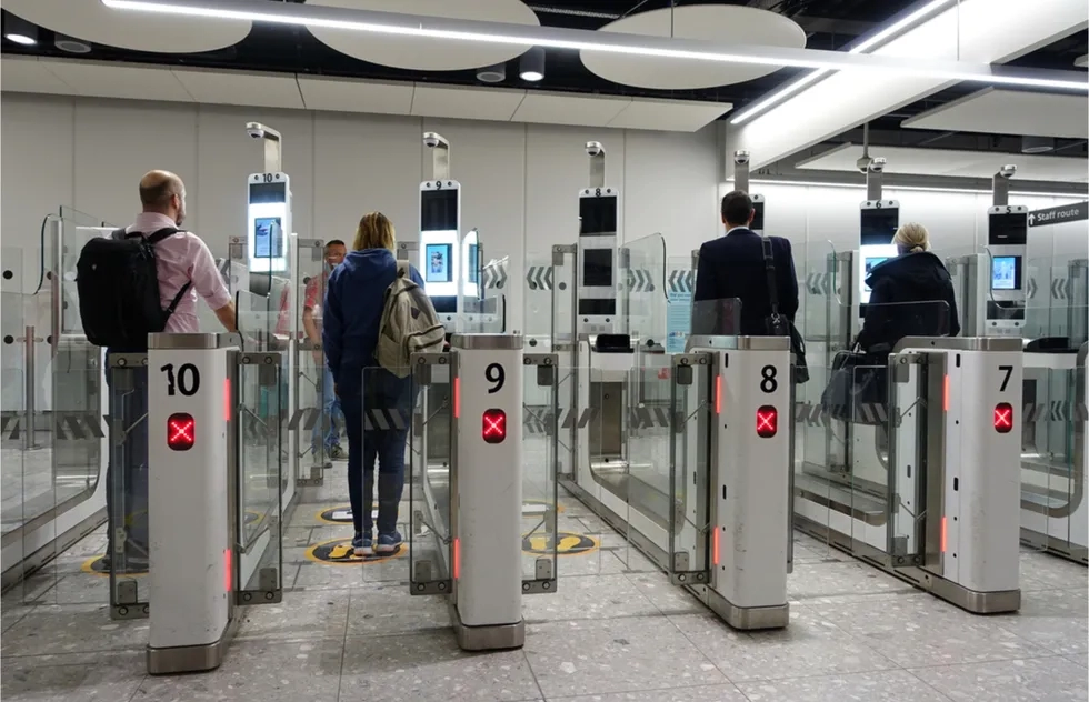 passengers pass through United Kingdoms's automated immigration gates