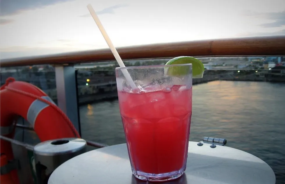 Seabreeze cocktail with plastic straw on cruise ship deck