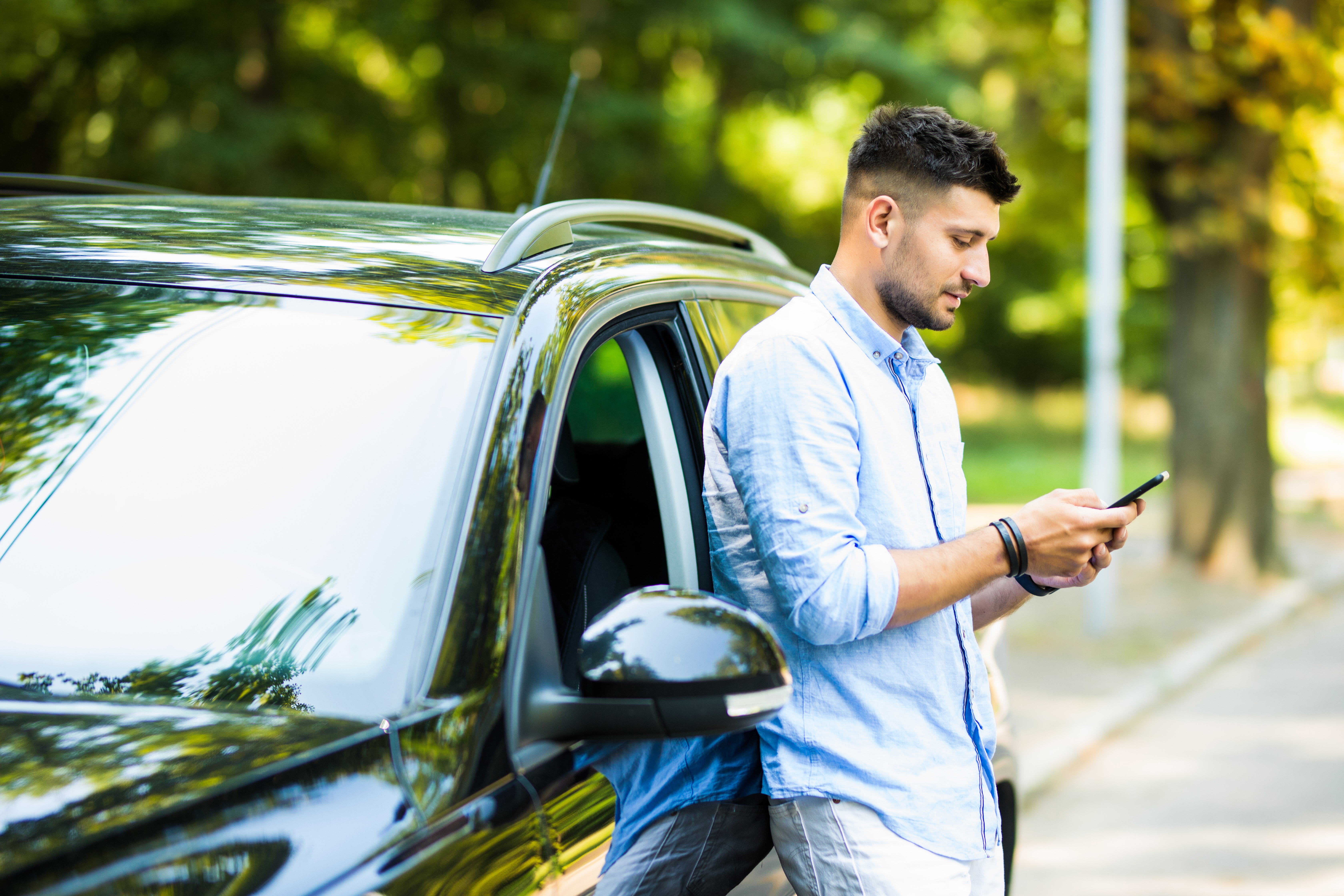 Texting while standing next to a car