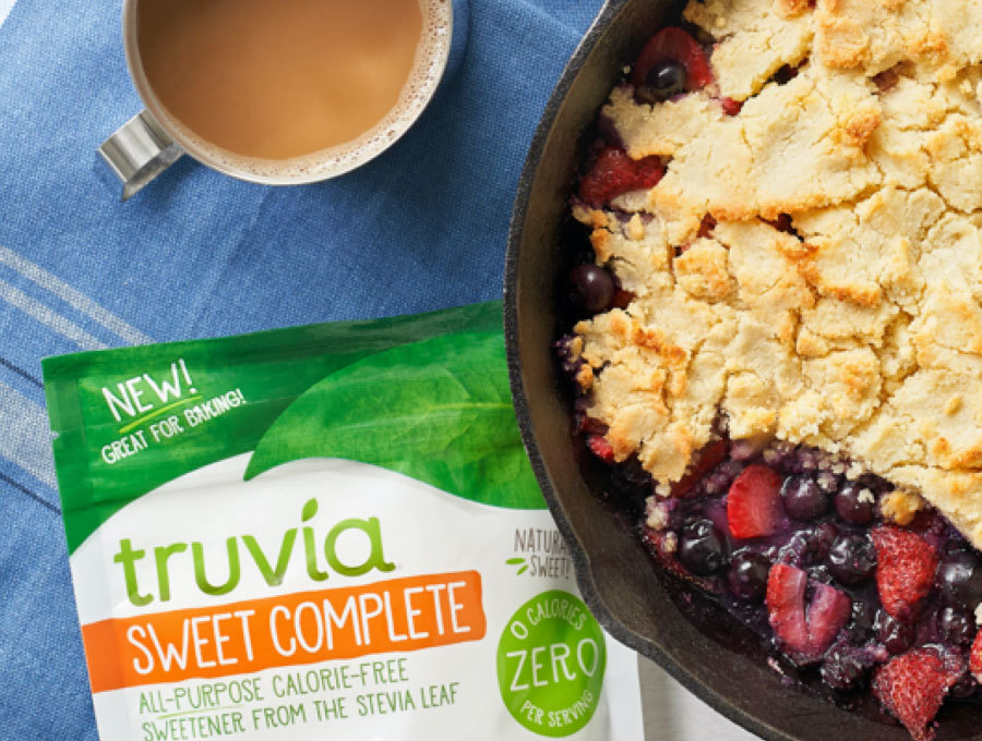 Berry cobbler sitting next to a bag of Truvia sweet complete
