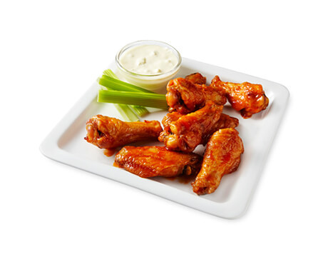 Buffalo Hot Wings with celery and sauce