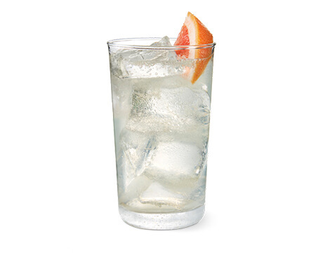 Citrus Bowl Cocktail in a clear glass with grapefruit garnish