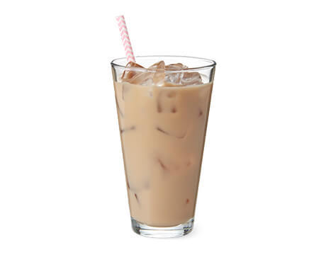 Coconut Cold Brewed Coffee in a clear glass with a straw
