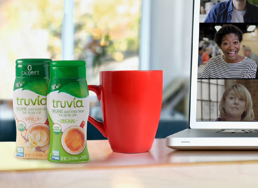 Bottles of Truvia organic liquids next to a mug and laptop computer