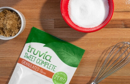 Bag of Truvia sweet complete and baking utensils on counter top