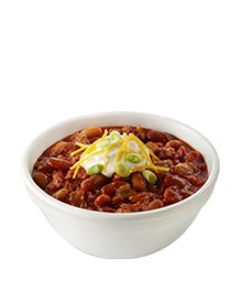 bowl of turkey chili with sour cream and cheese