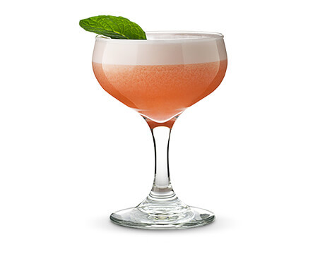 Clover Club cocktail in a clear glass with mint leaf garnish