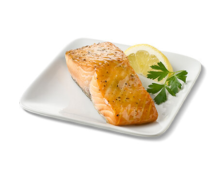Glazed Salmon on a white plate with garnish