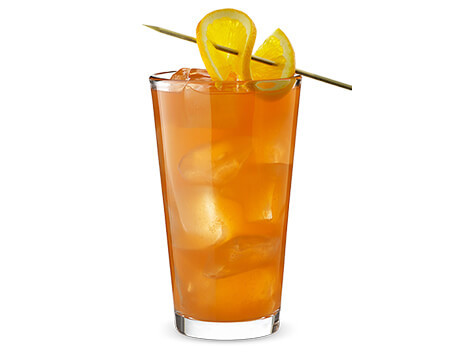 Hurricane cocktail in clear glass with garnish