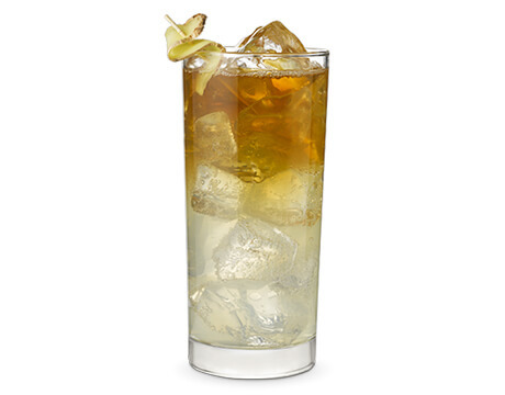 Ginger storm cocktail in a clear glass with garnish