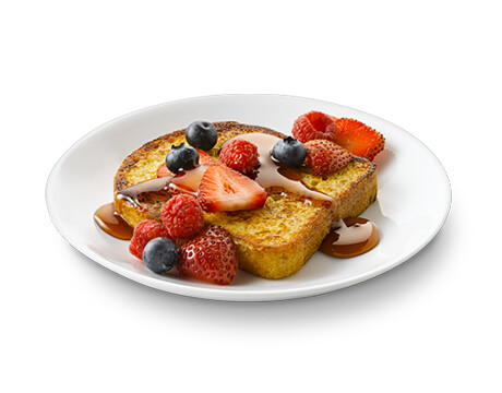 French Toast with mixed berries on a white plate
