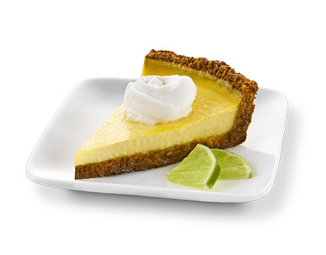 Slice of Key Lime Pie on a white dish