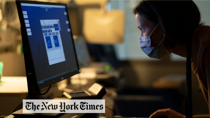 Image of a man looking at a computer screen