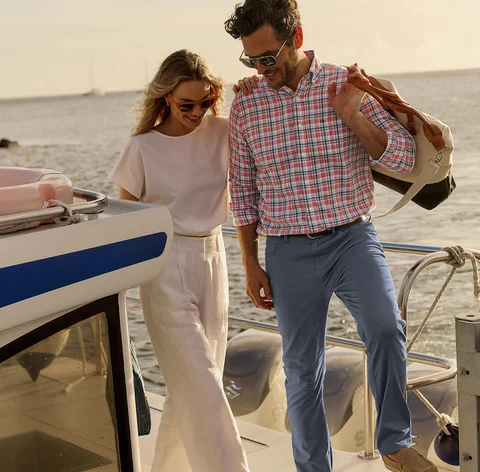 Man and women getting off boat