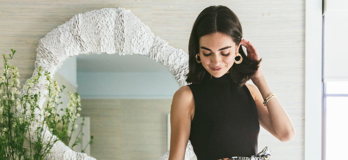 Women standing in front of mirror