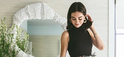 Women standing in front of mirror