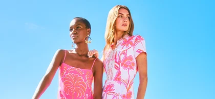 Two women with blue sky behind them