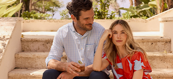 Man and women sitting on steps