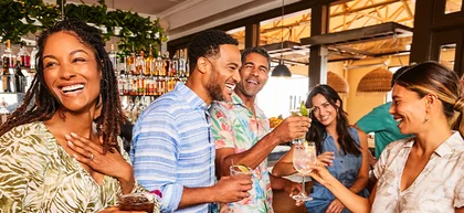 Group of people enjoying drinks at bar