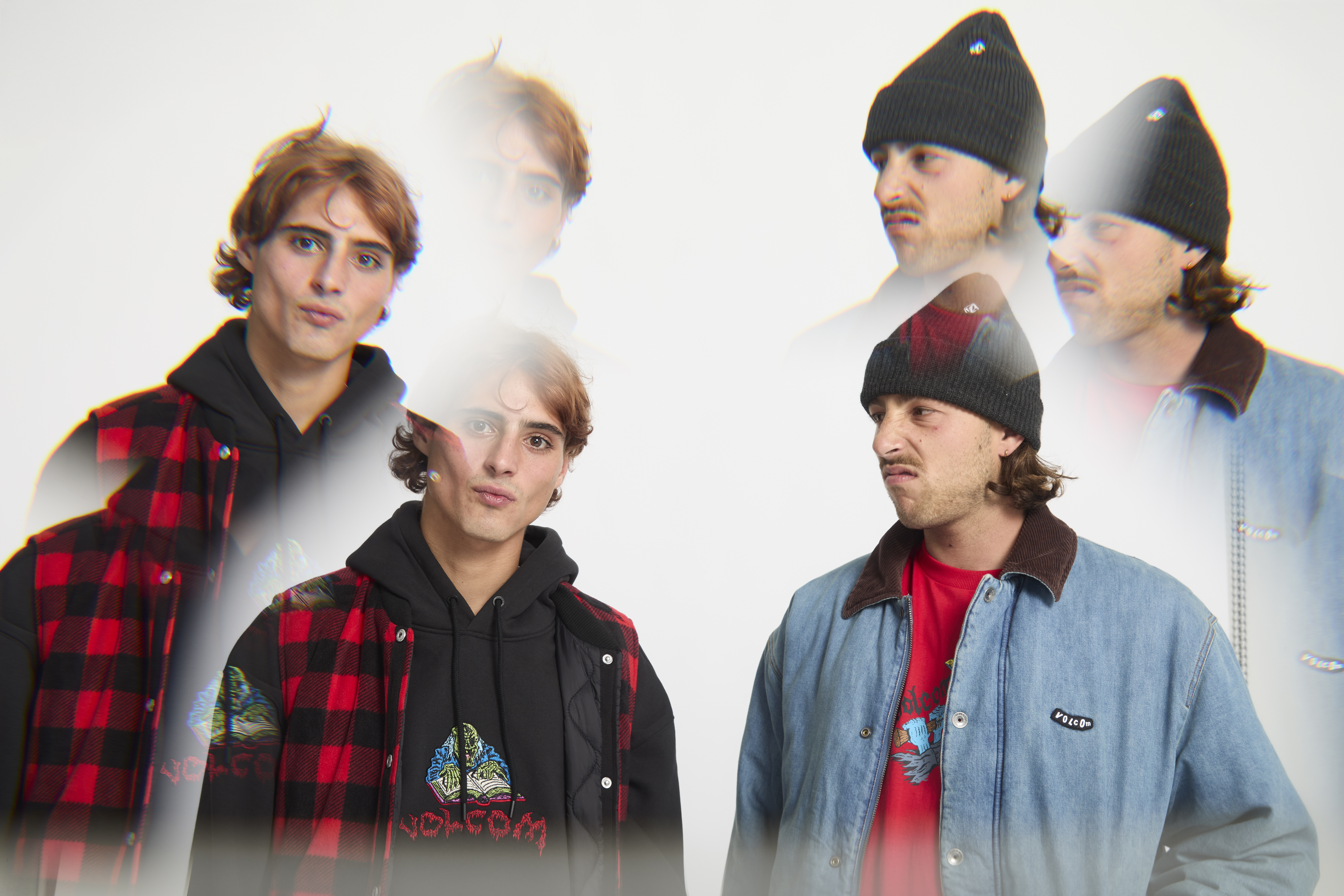 Five young people wearing winter clothing including beanies, red plaid shirts, and denim jackets against white background with motion blur.