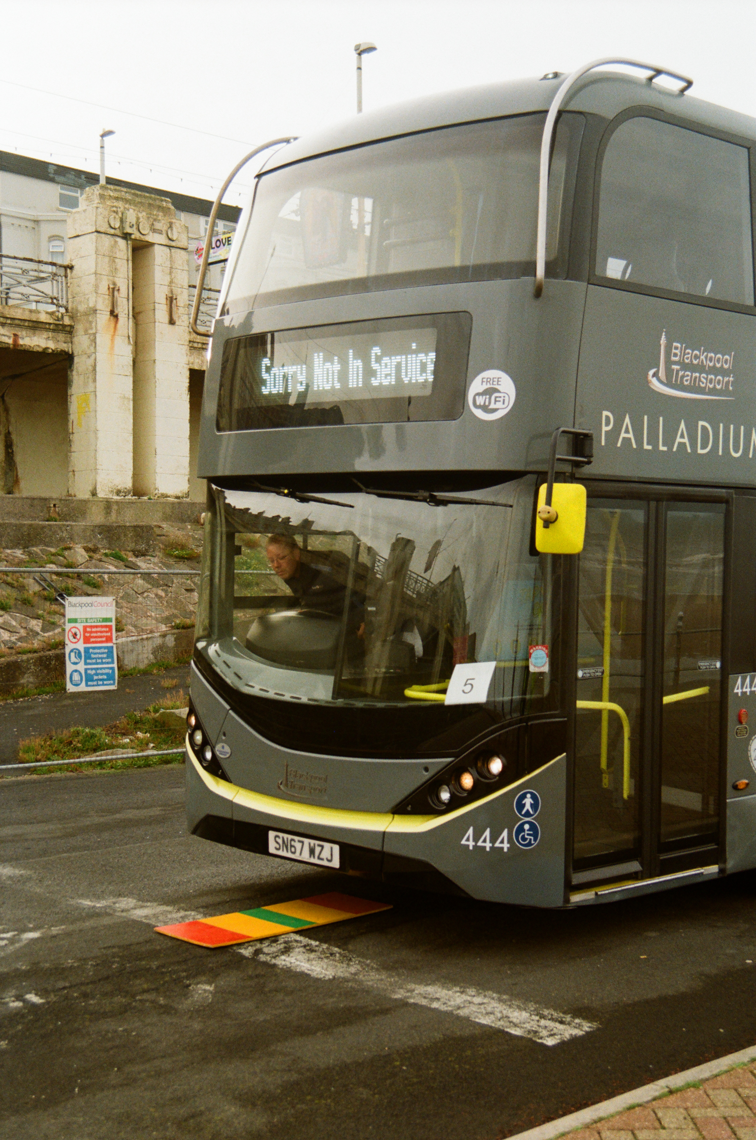Grey double-decker Blackpool Transport bus displaying "Sorry Not In Service" with "Palladium" destination, parked on street.