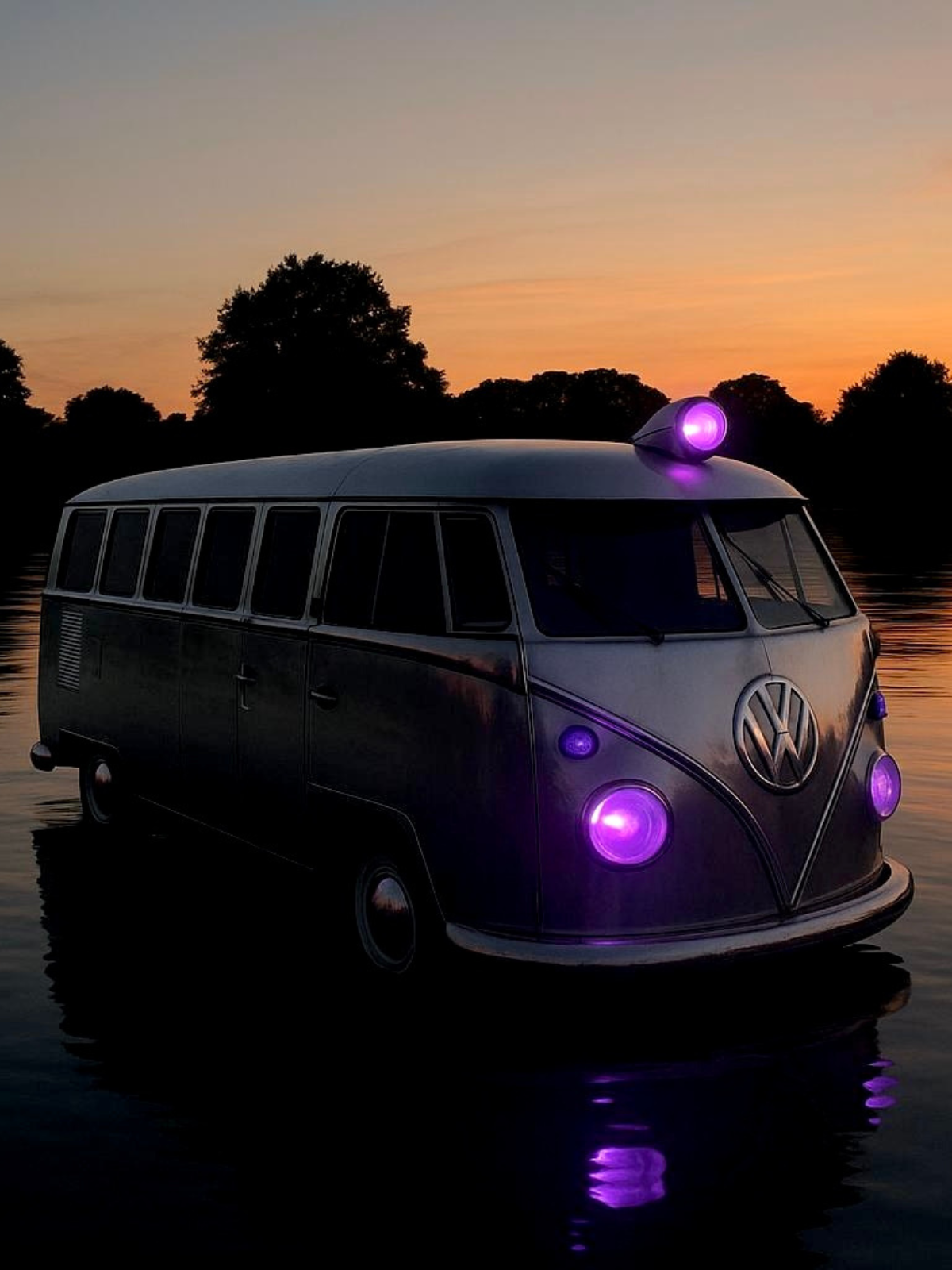 Volkswagen van with purple glowing headlights and roof light against orange sunset sky, dark tree silhouettes, water reflection below.