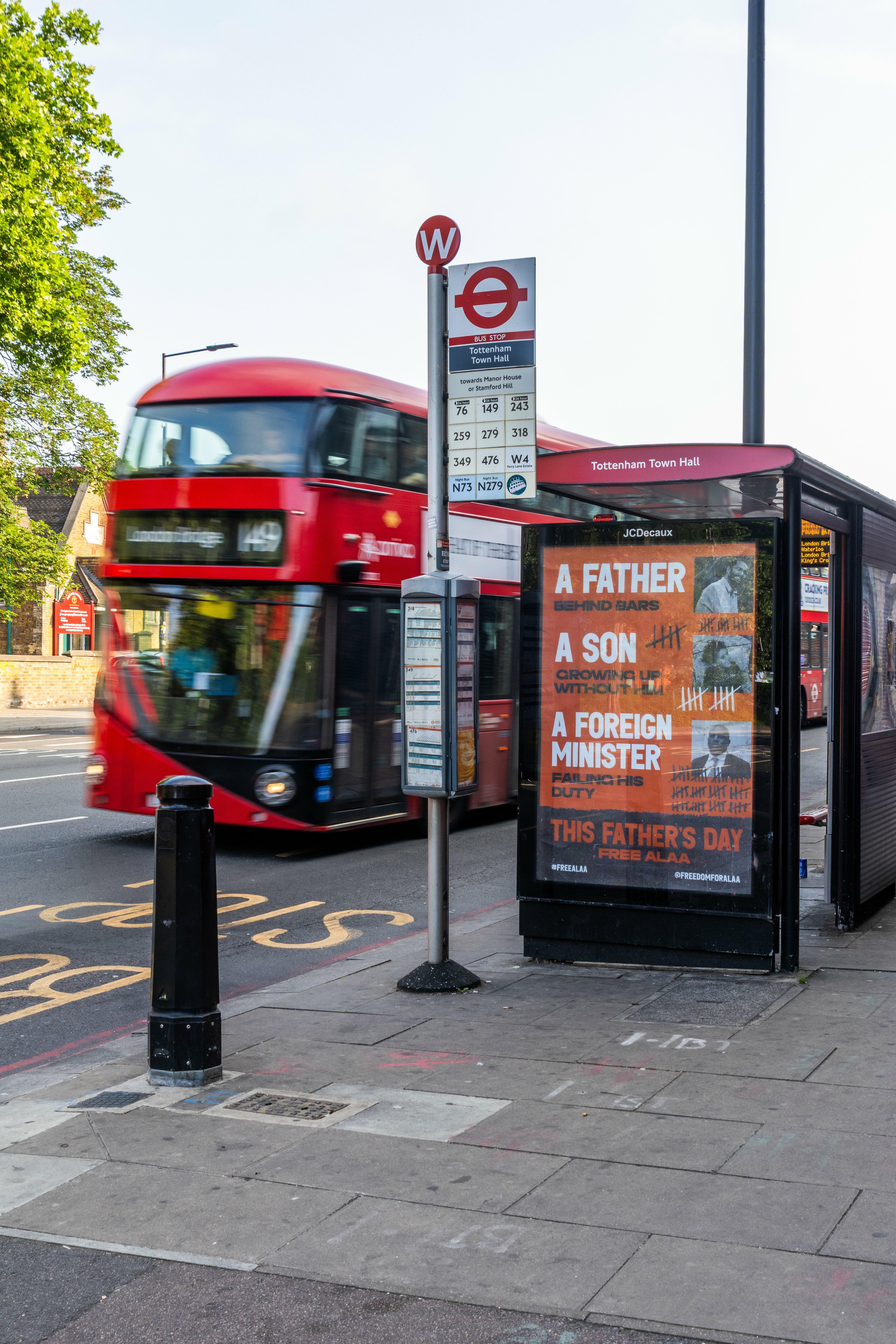 Red double-decker bus, Underground sign, advertising poster for Father's Day event