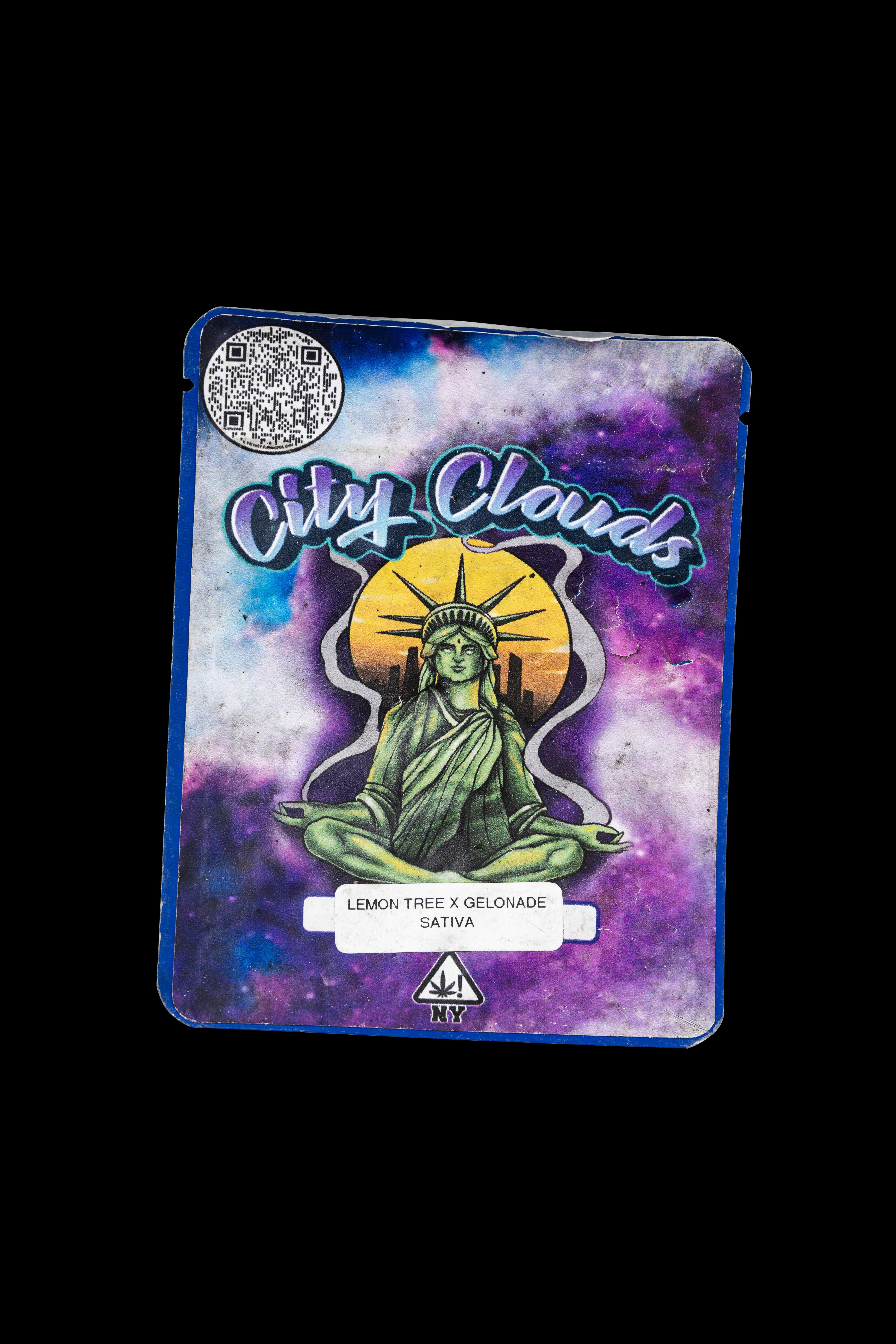 City Clouds branded cannabis product packaging with an illustration of the Statue of Liberty in a psychedelic, cosmic style background.