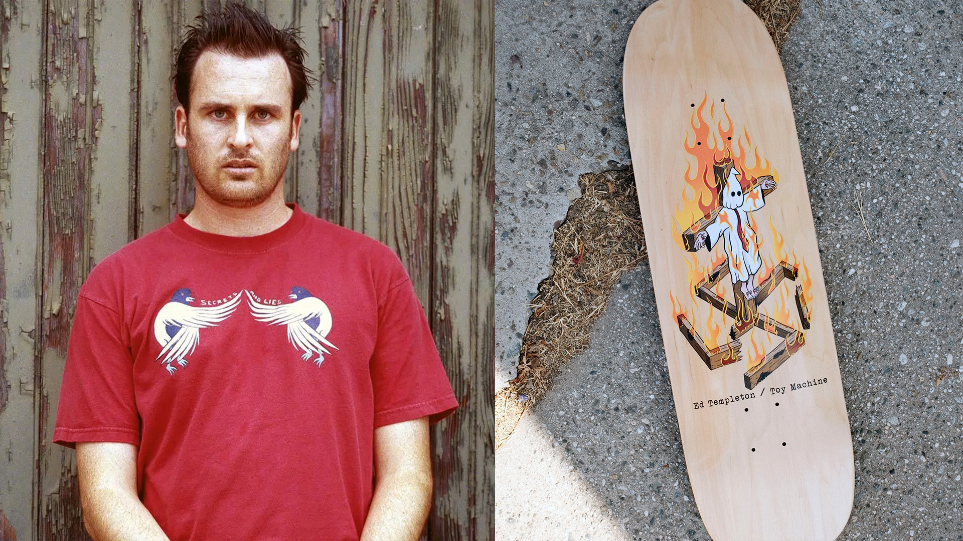 Man in red t-shirt with white bird design stands beside weathered wooden fence; skateboard with cartoon character graphic lies on pavement.