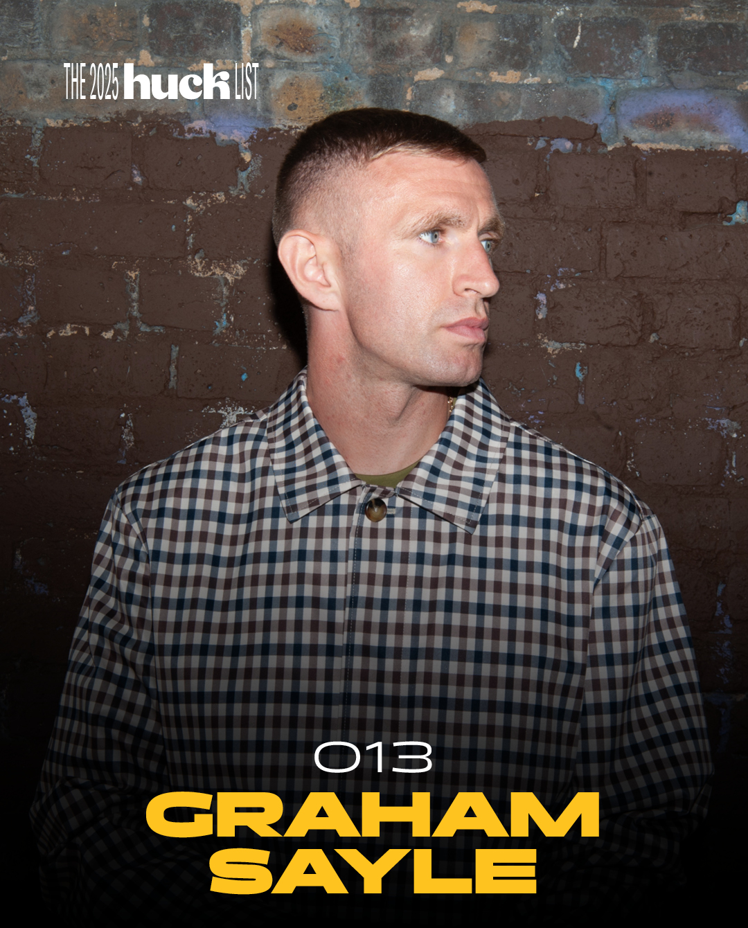 Man in chequered shirt against weathered brick wall, profile view. Yellow text reads "013 GRAHAM SAYLE" with "THE 2023 huck LIST" logo.