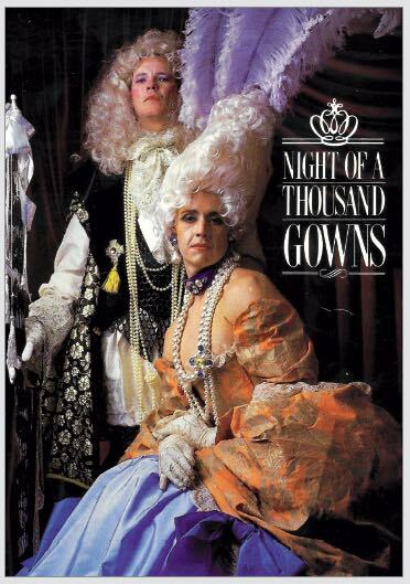 Two individuals wearing ornate, colourful period costumes with elaborate headdresses and jewellery against a dark background.