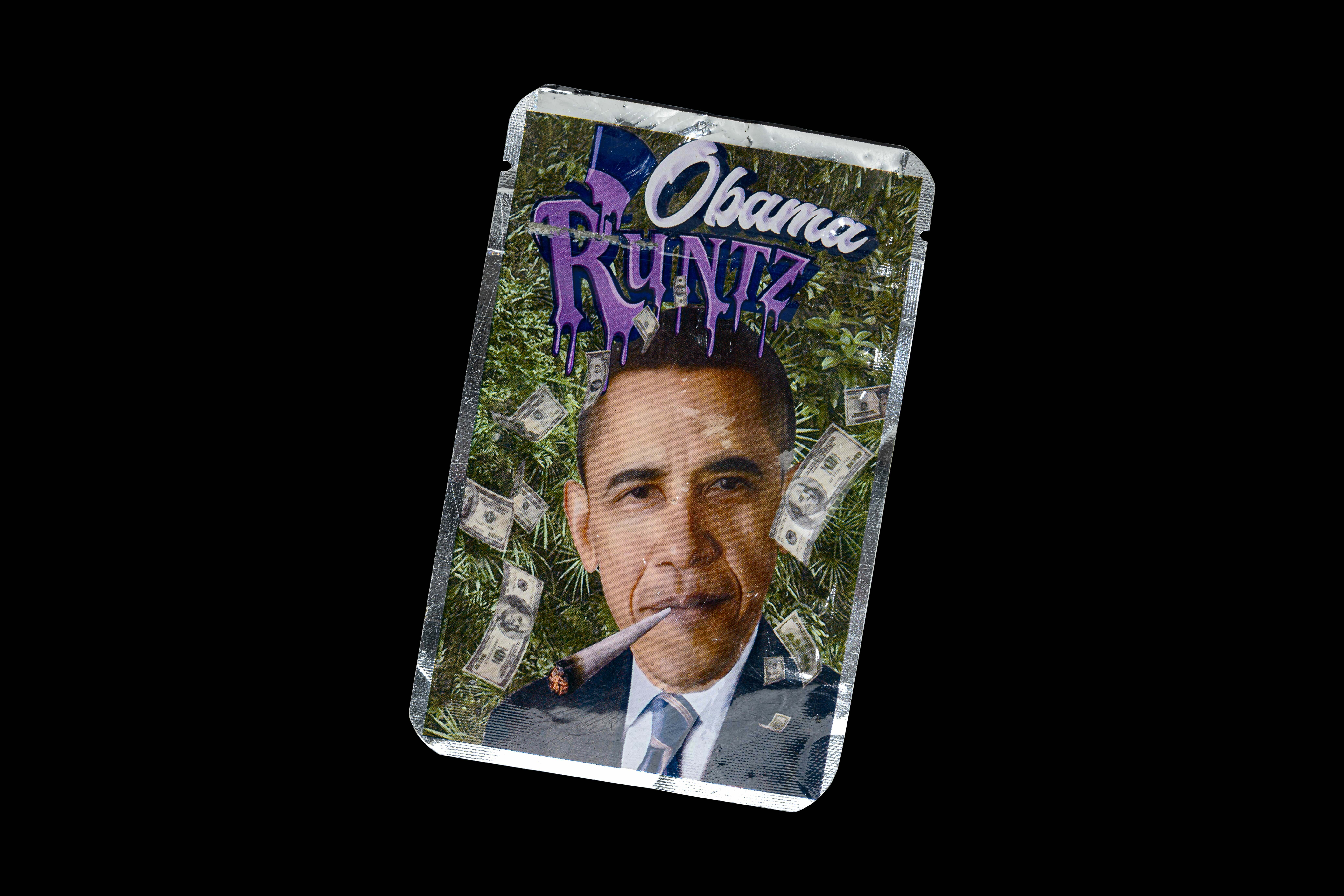 Image shows a person's face on a playing card-style design, with the text "Obama Runtz" on the card.