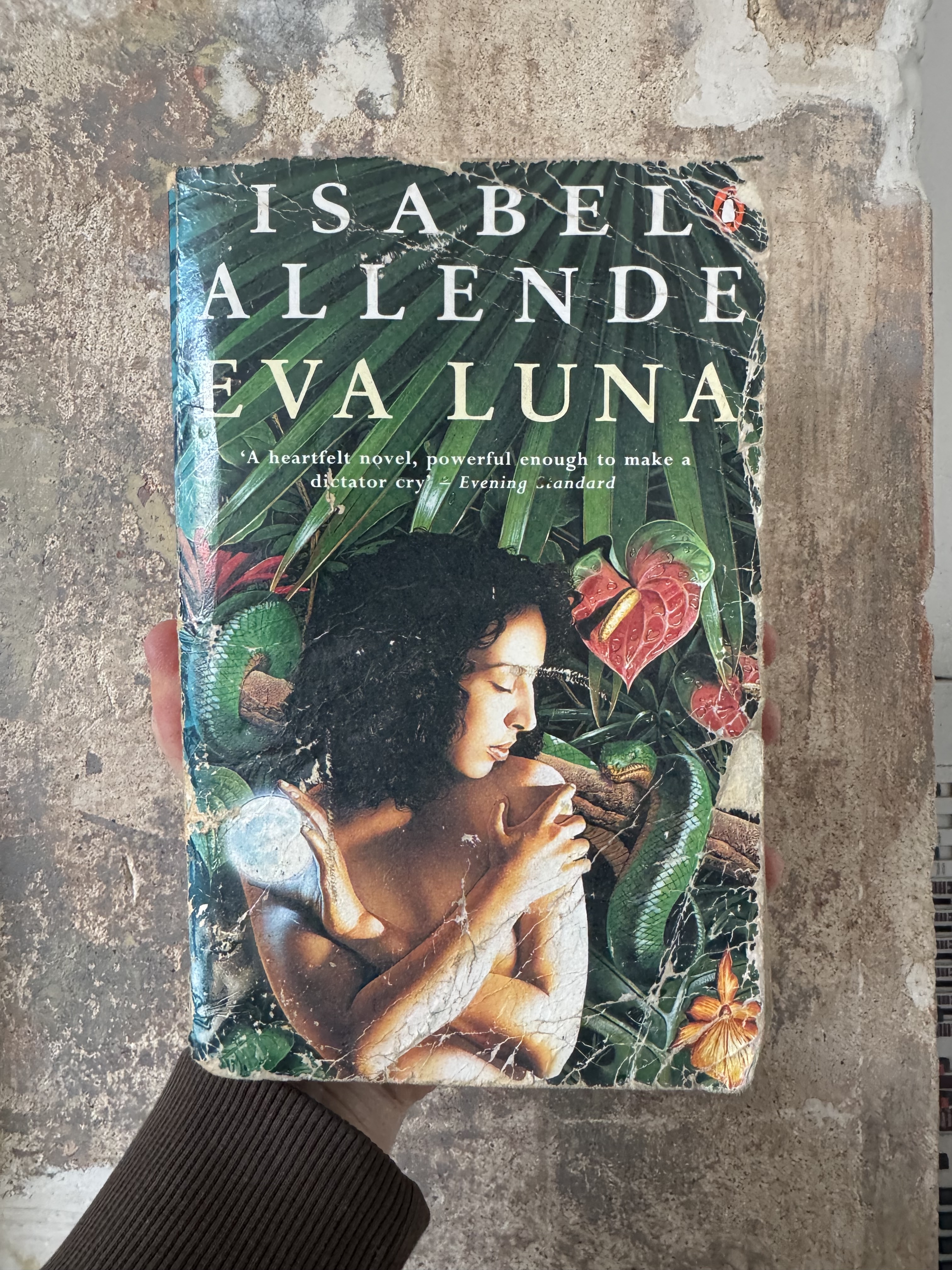 Book cover featuring a portrait image of a woman surrounded by tropical flora against a mottled background.