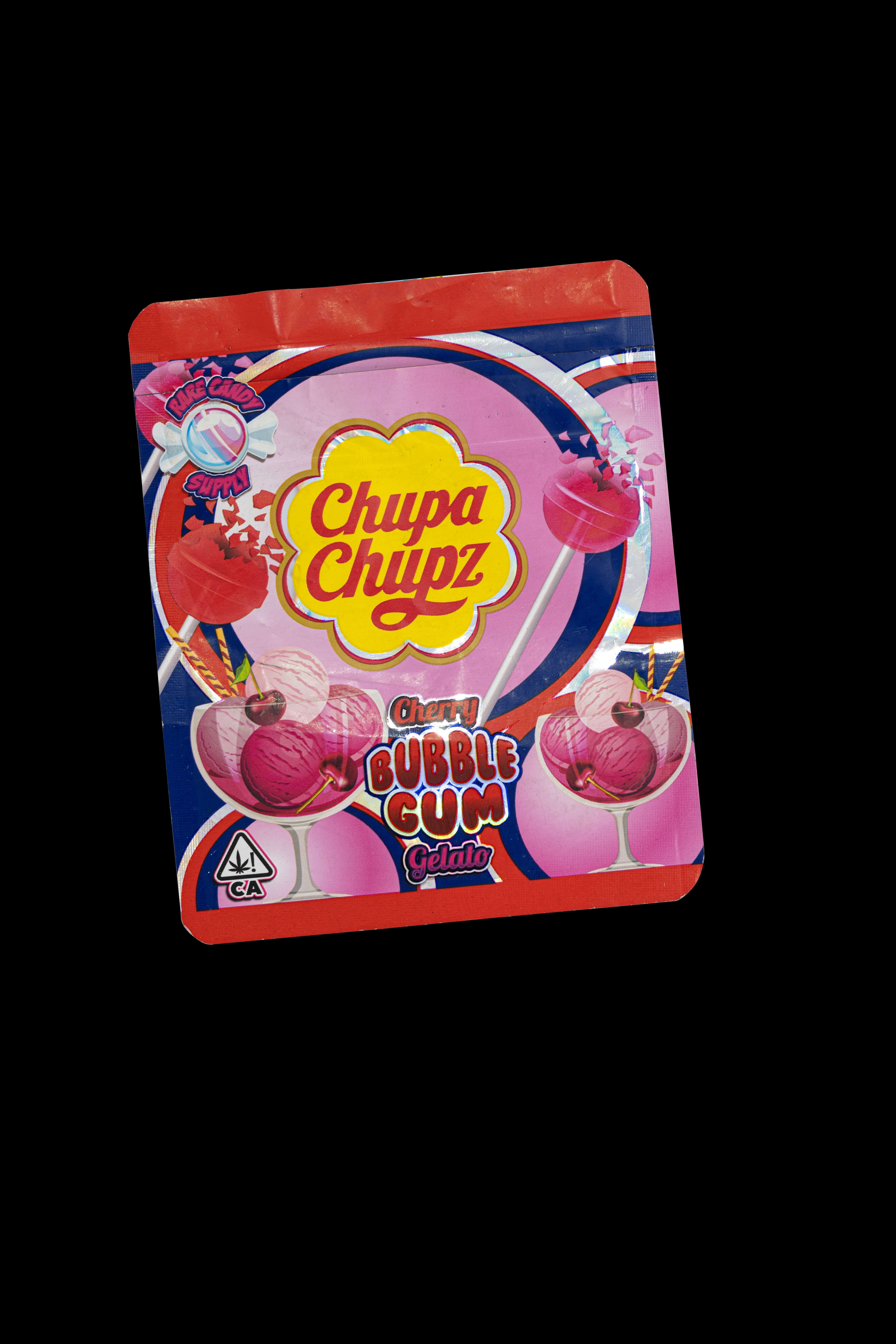 Brightly coloured package of Chupa Chups bubble gum, featuring the brand's iconic logo and illustrations of sweets and lollipops.