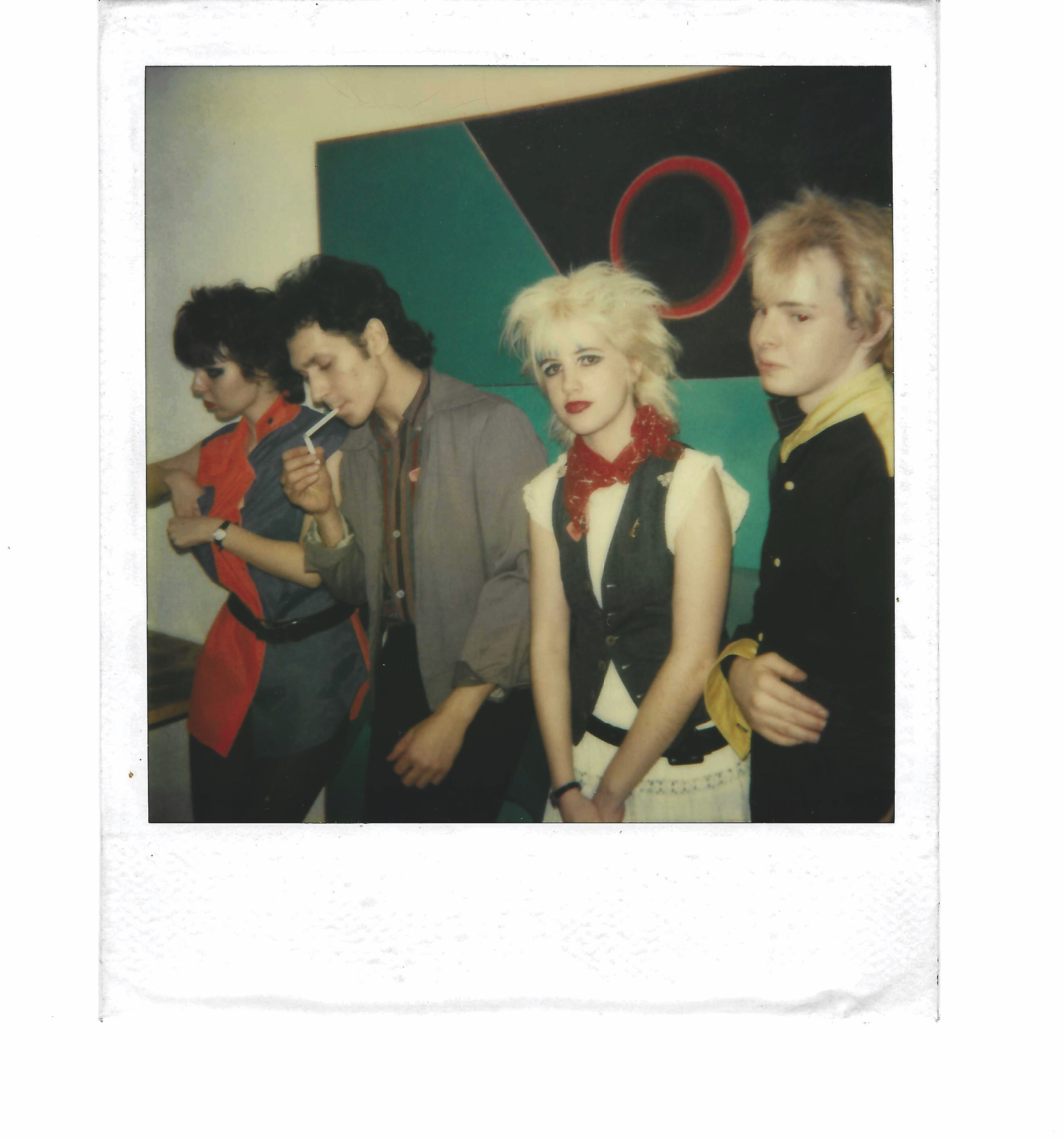 Four individuals, a group shot, bright colours, geometric shapes in the background.