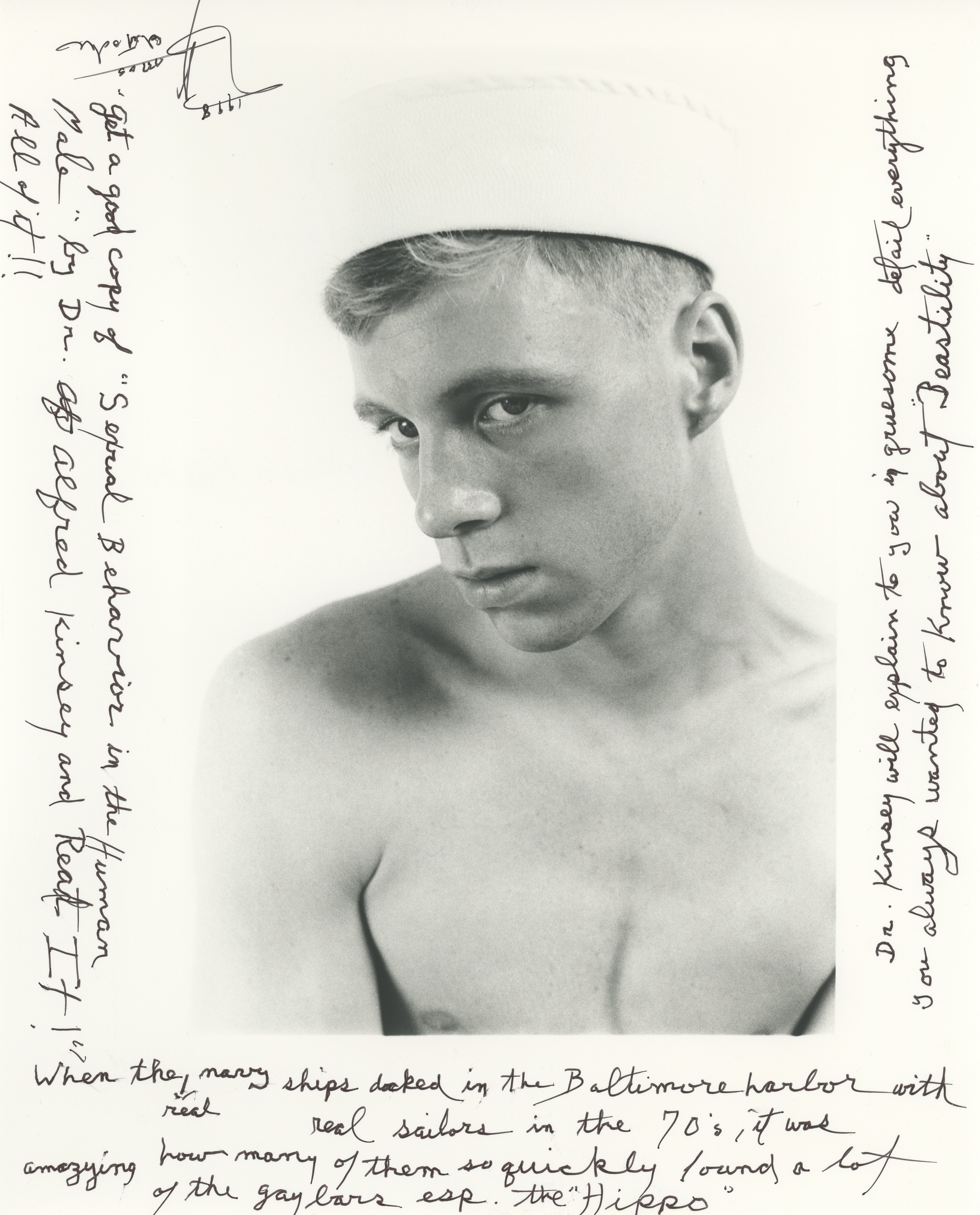 Black and white portrait of shirtless young man with handwritten notes covering margins and bottom of image on cream background.