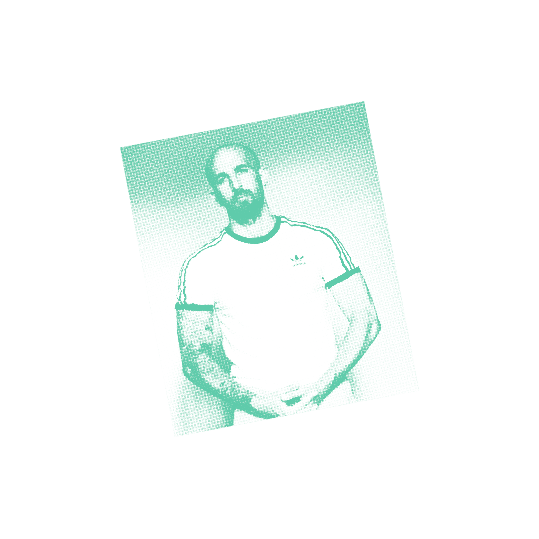 Tilted square image with green and white tones showing a bearded man in a white t-shirt against black background.