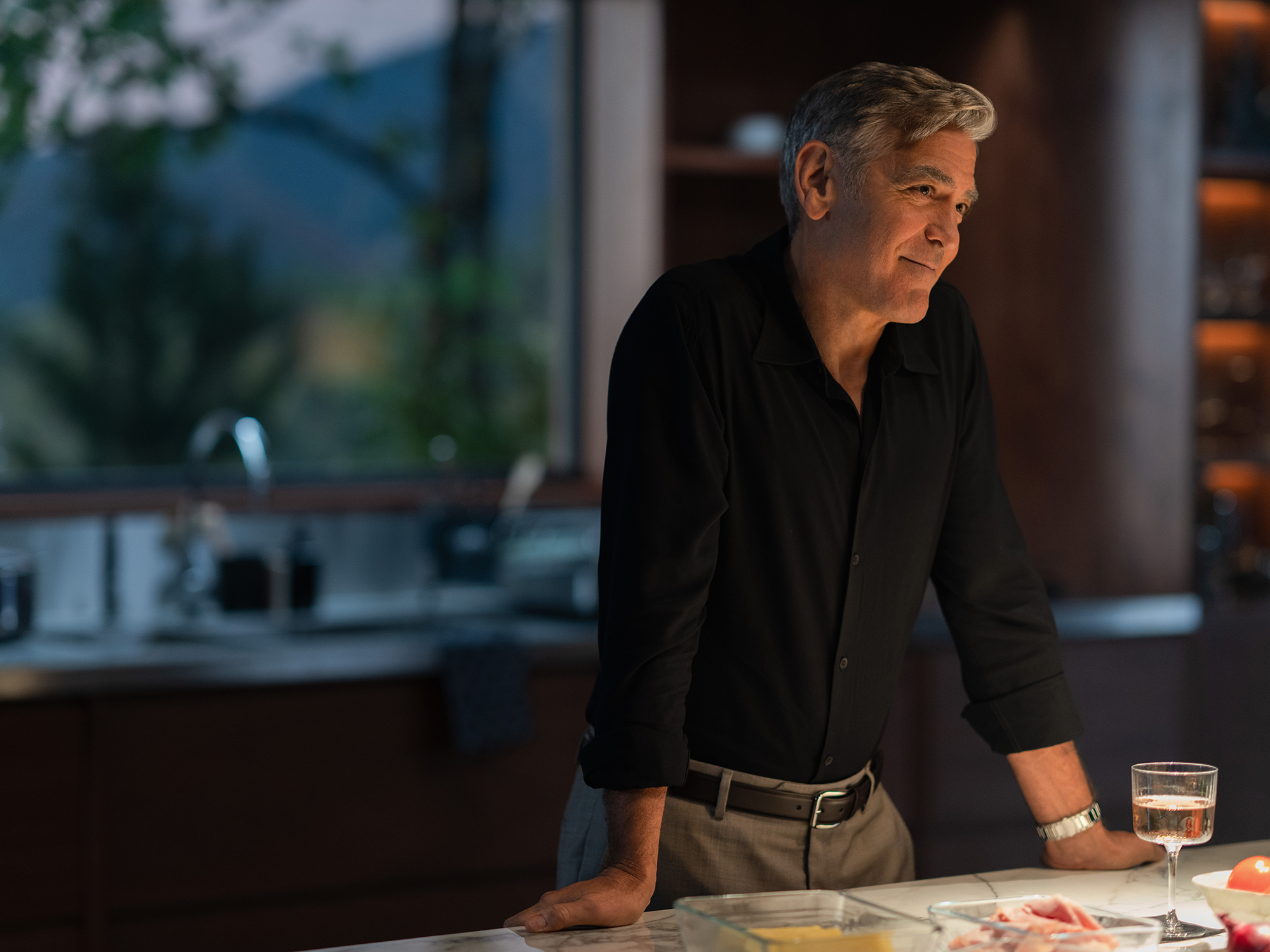 George Clooney standing in a high end kitchen