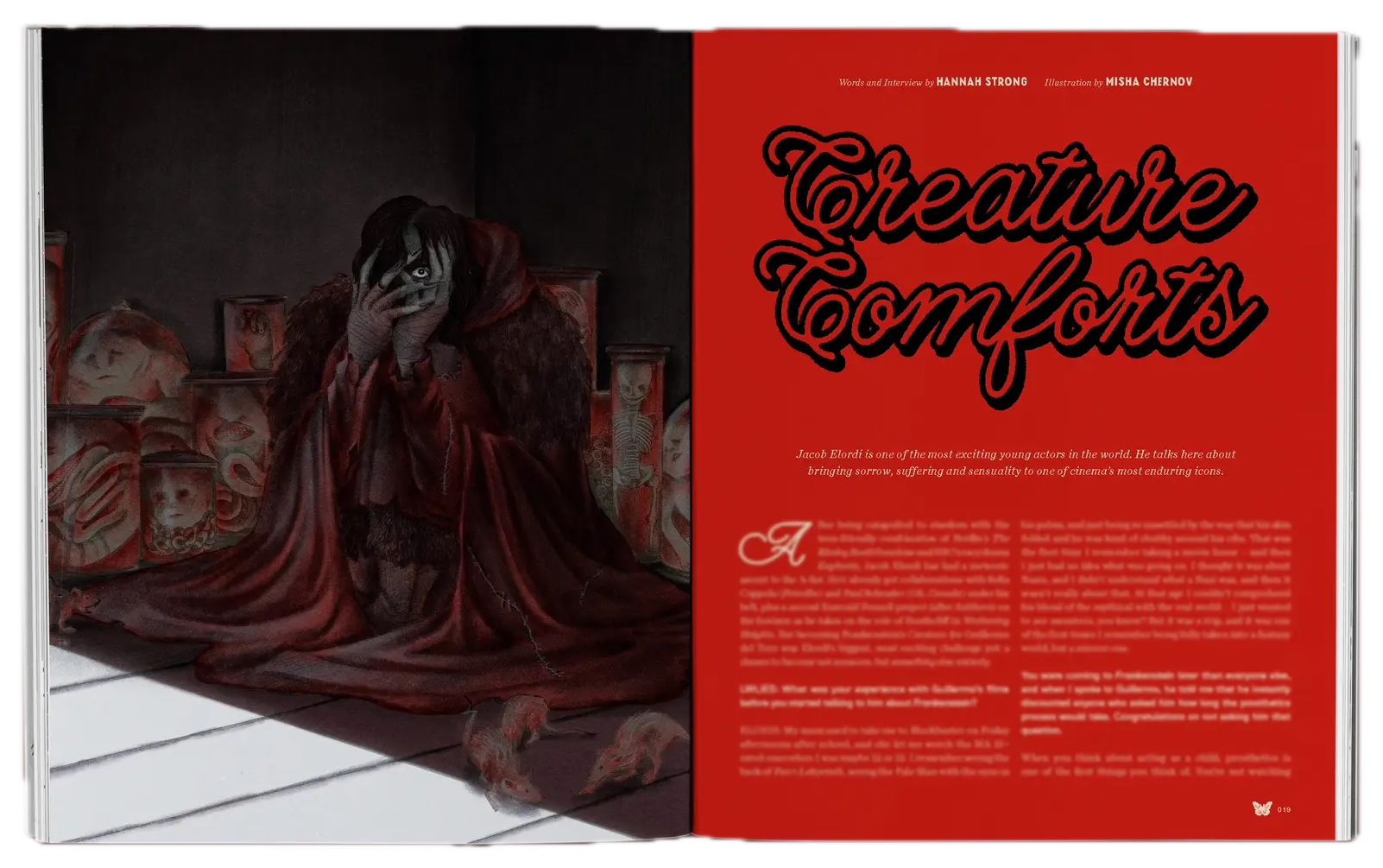 Open book spread showing dark sculptural figure draped in burgundy fabric on left page, bright red page with "Creature Comforts" text on right.