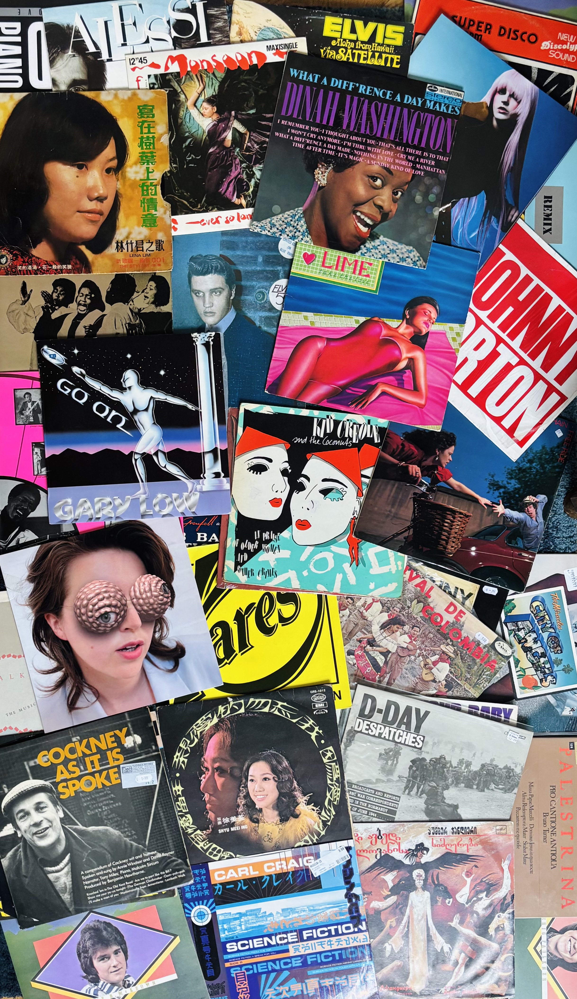 Collection of overlapping vintage record albums, magazines and pop culture memorabilia with colourful covers featuring various artists and text.