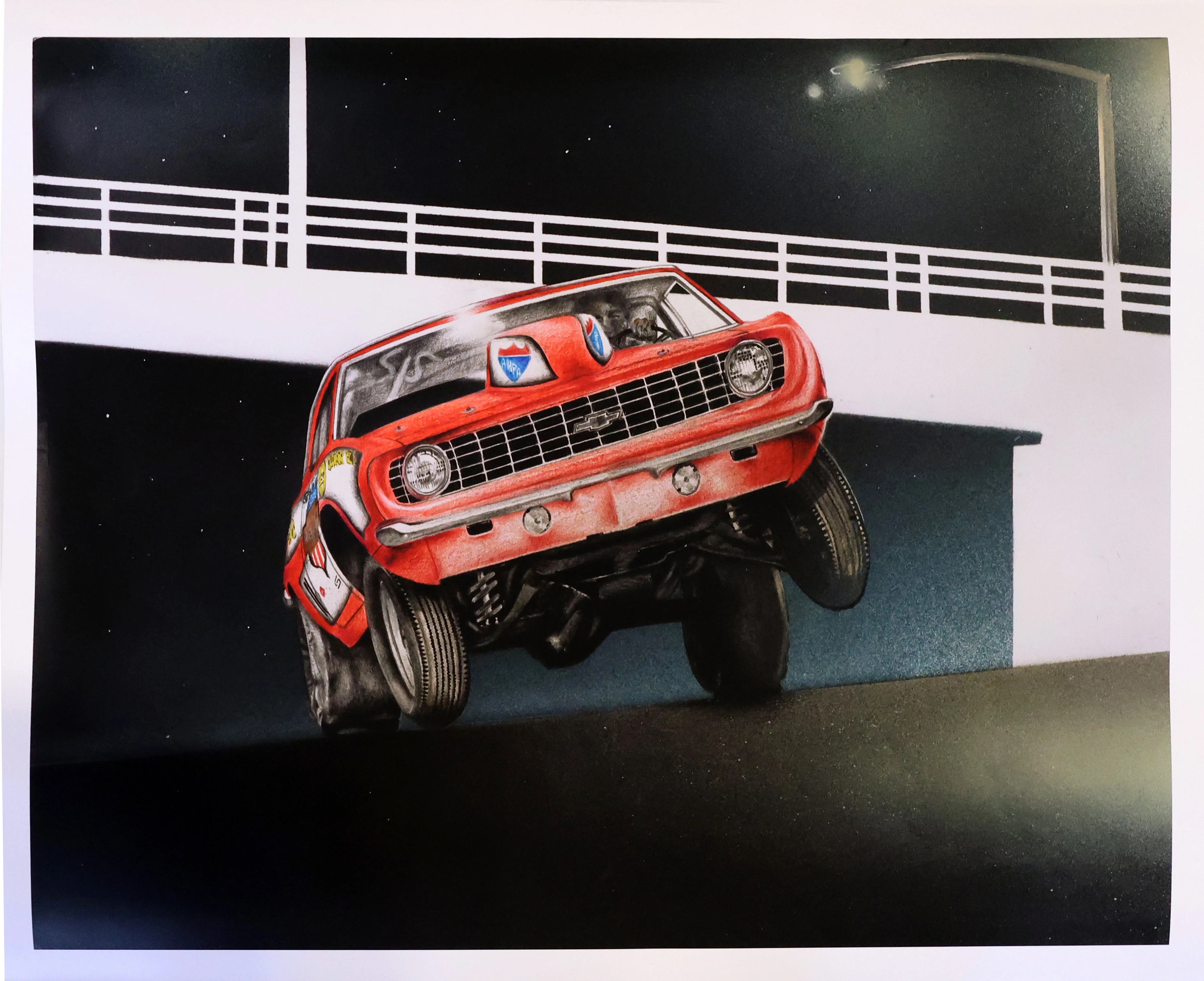 Red vintage muscle car airborne on concrete ramp with white railings against dark background with street lamp.