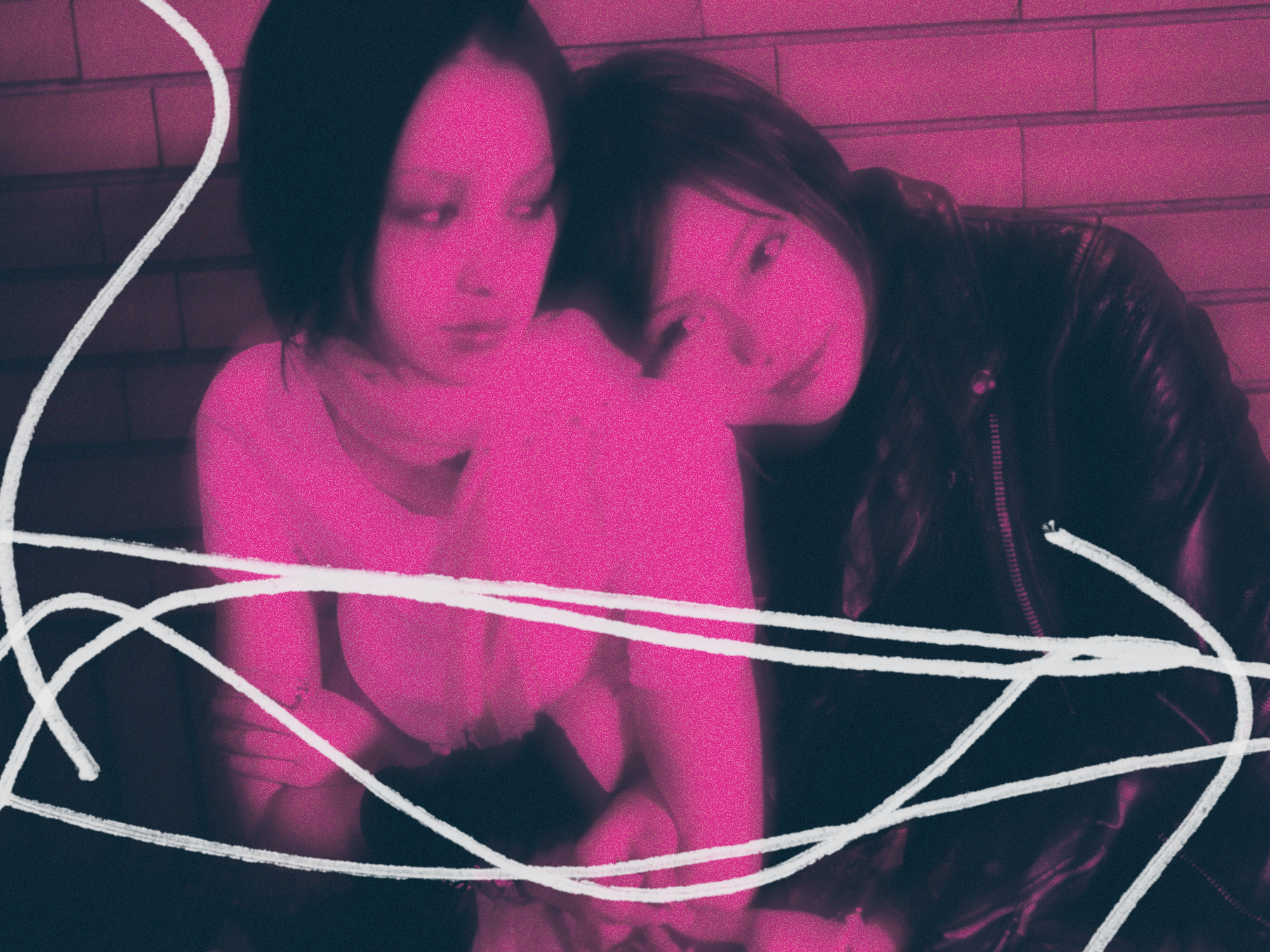 Two women with dark hair against brick wall, overlaid with pink filter and white geometric line patterns forming angular shapes.