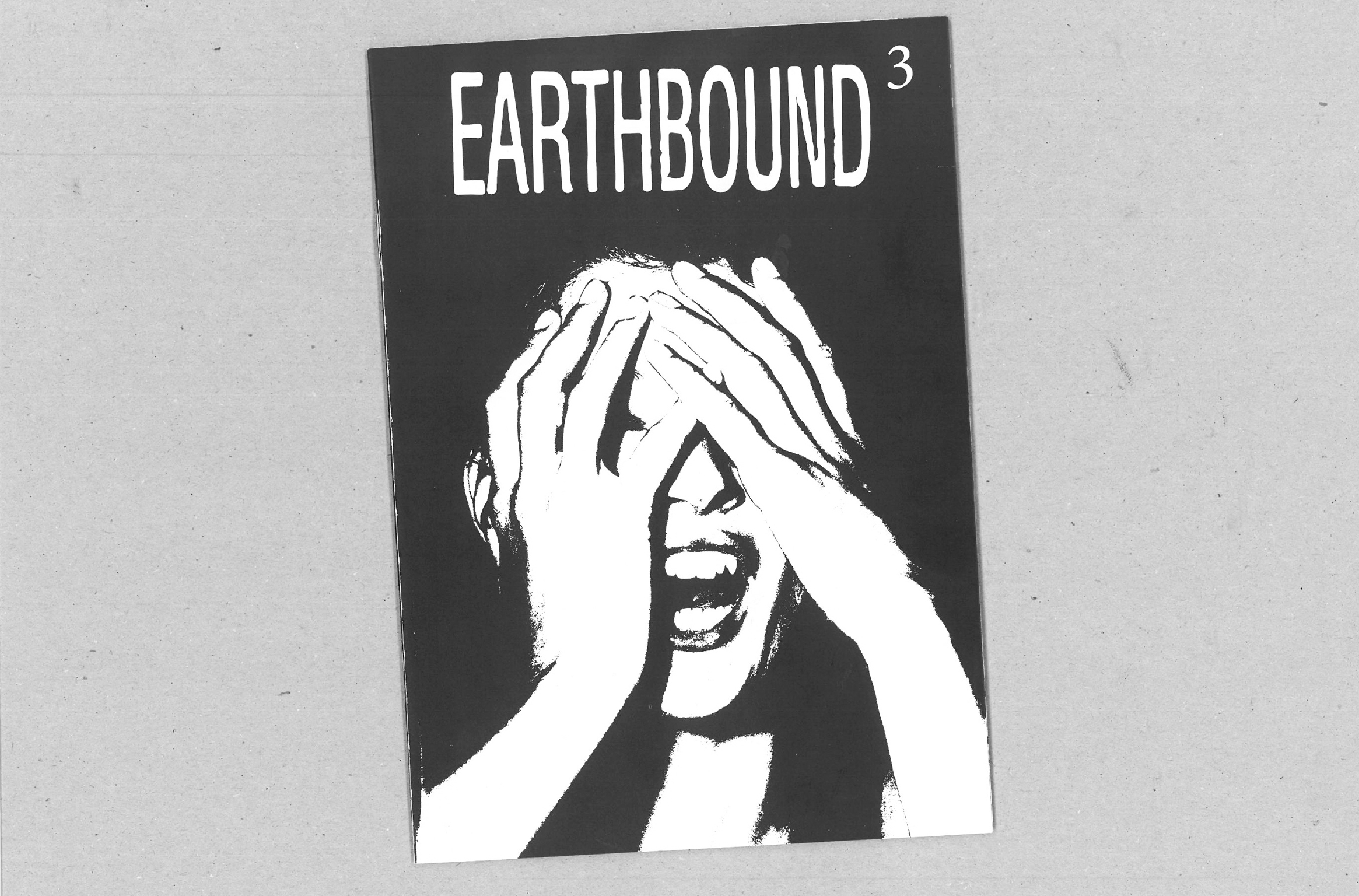 Black and white comic book cover with "EARTHBOUND 3" text at top. White figure with hands covering face against black background.