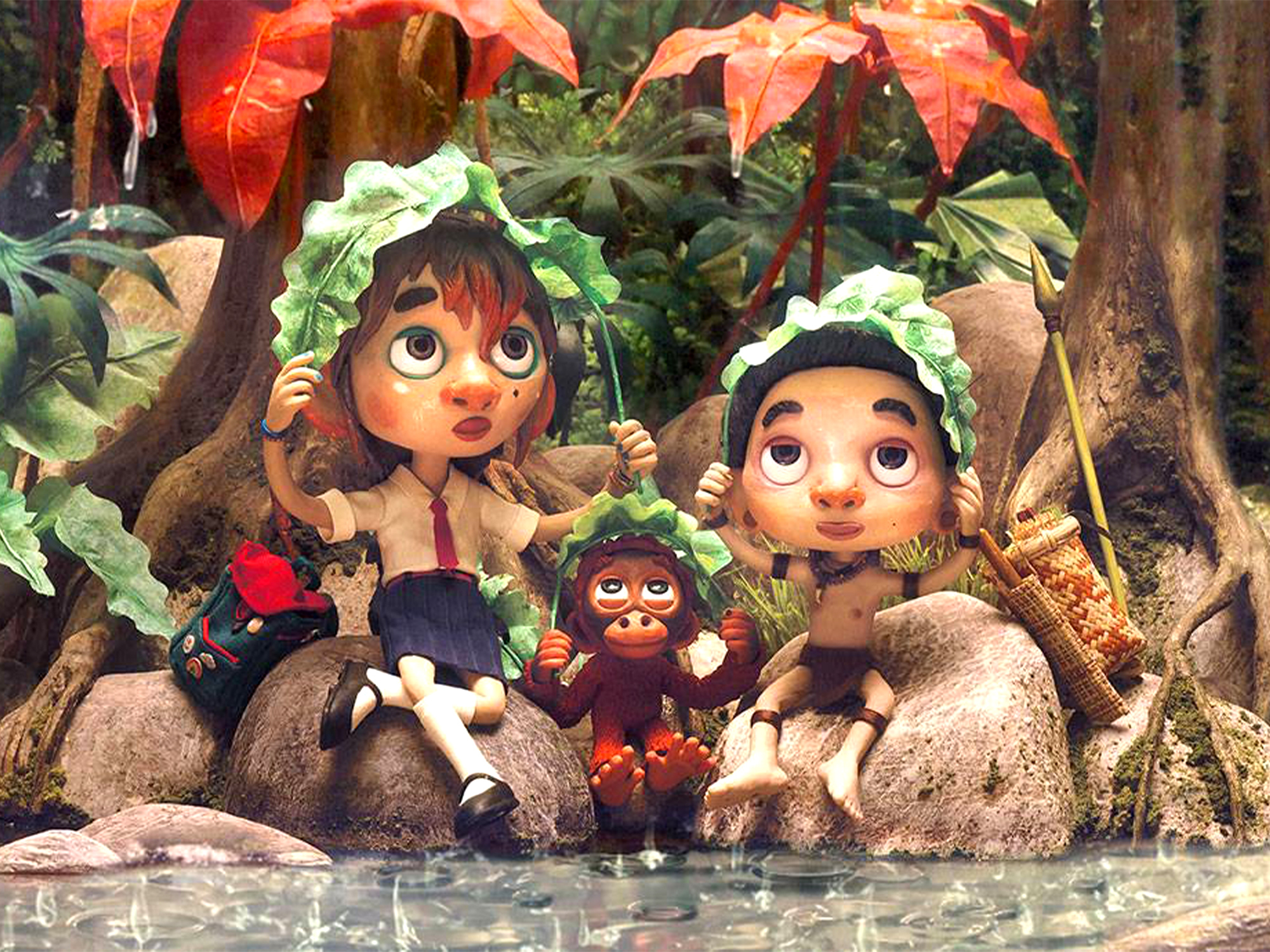 Three cartoon children with large eyes sheltering under green leaves by water, surrounded by autumn foliage and tree roots.