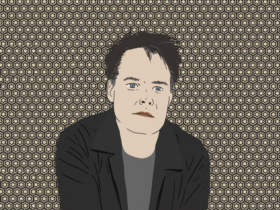 A man with short dark hair and a serious expression against a patterned black and white background.