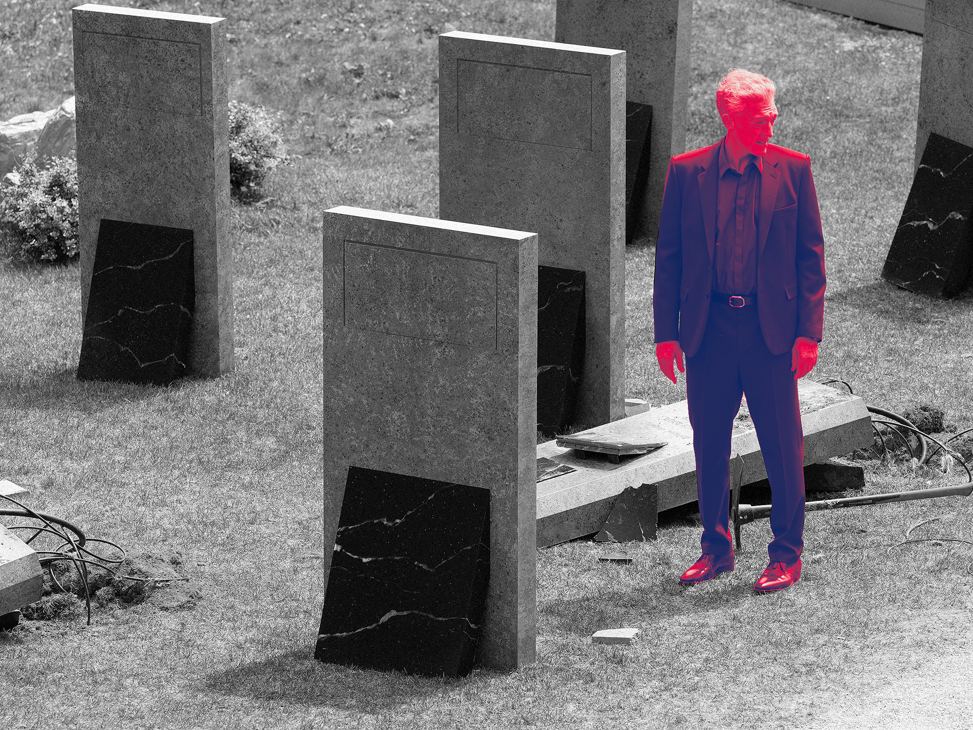 Monochrome image with bright pink and blue figure standing amongst grey concrete blocks and scattered debris on rough ground.