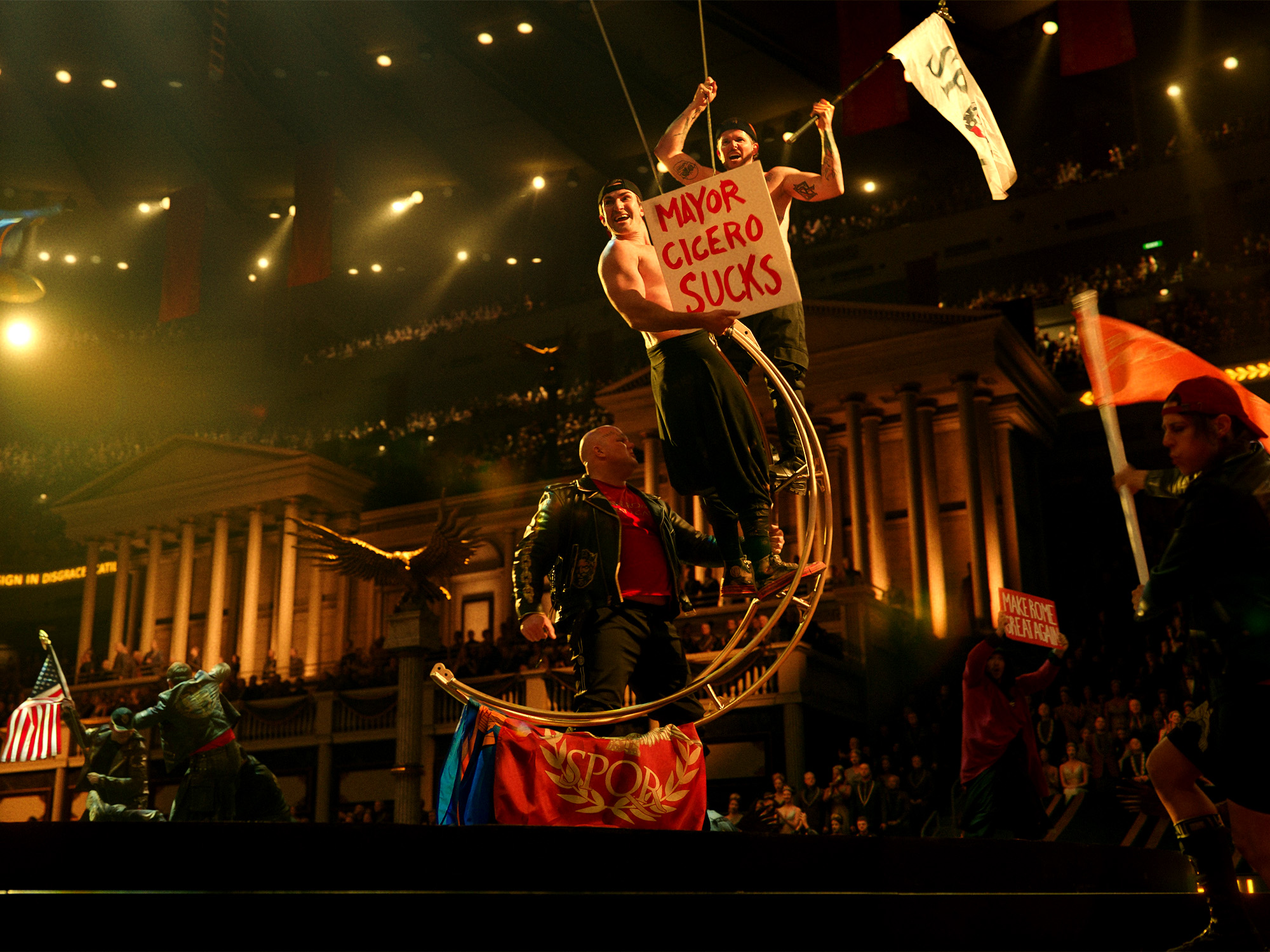 Protesters on a pirate ship float holding "MAYOR CICERO SUCKS" sign at night with illuminated building columns in background.