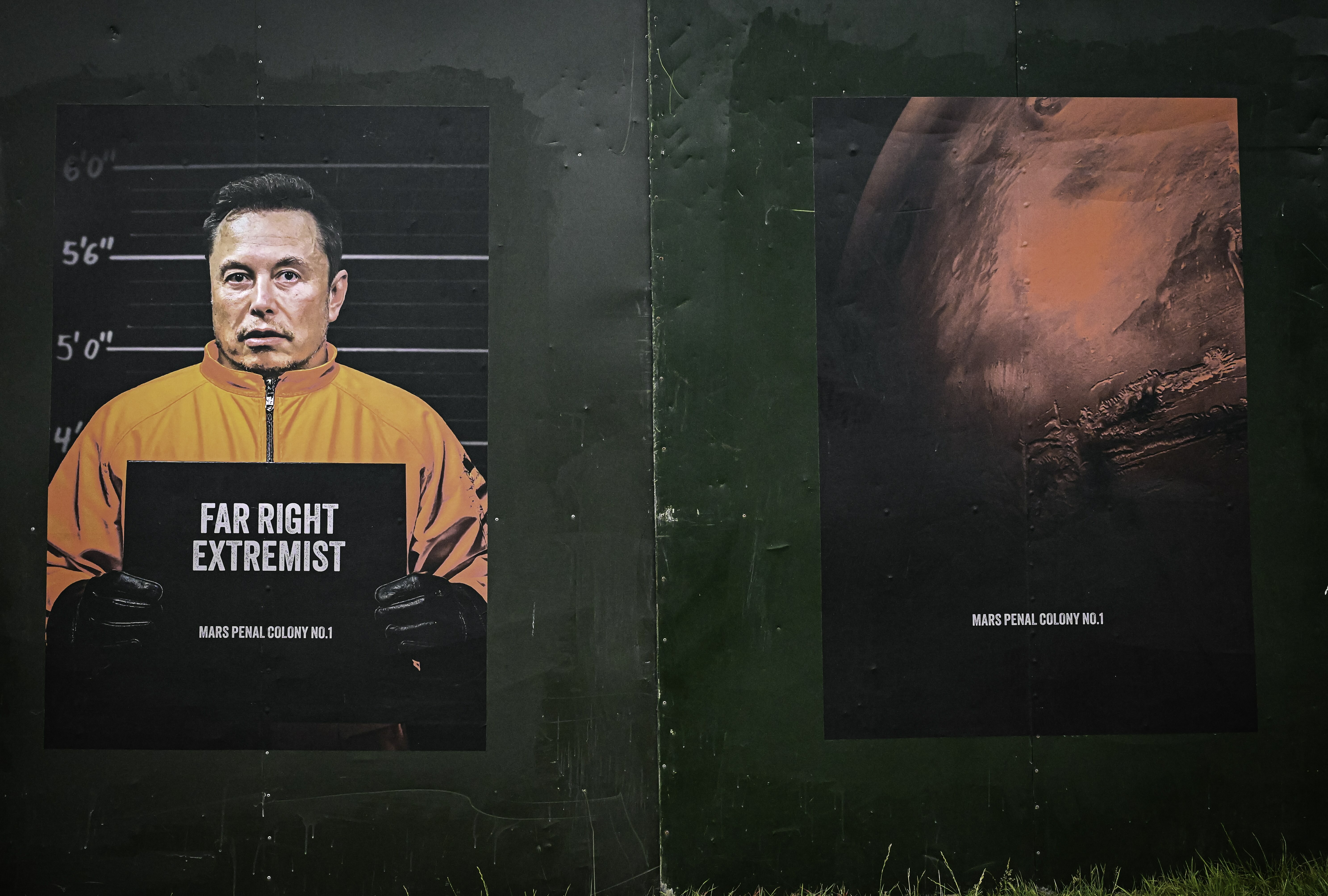 Two posters on green wall: left shows mugshot-style image with orange uniform and "FAR RIGHT EXTREMIST" text; right displays red abstract imagery.